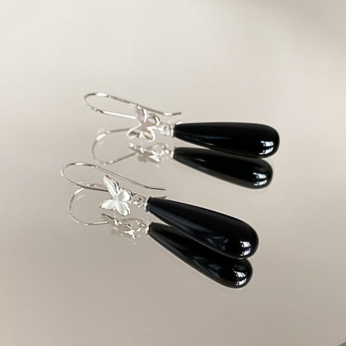 Butterflies glisten with black onyx drops with these stylish earrings by INIZI